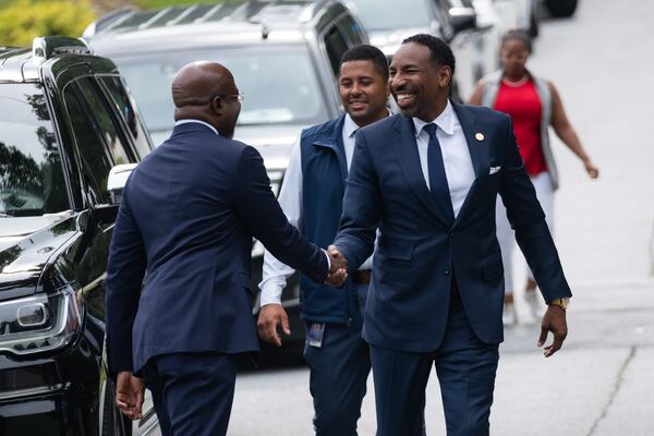 Atlanta Mayor Andre Dickens (right) greets U.S. Sen. Raphael Warnock before their news conference about the 21st Century ROAD to Housing Act on Monday, July 13, 2026. (Ben Gray for the AJC)