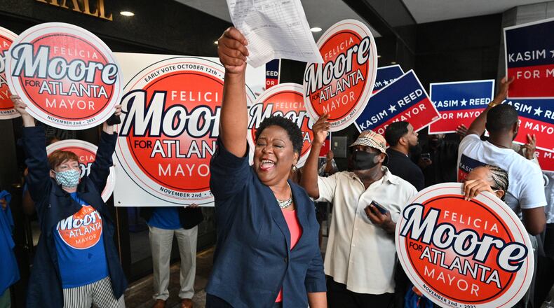 August 17, 2021 Atlanta - Atlanta City Council President Felicia Moore pumps her fist after filing paperwork for November 2nd Atlanta Mayoral Election outside the Atlanta City Hall on Tuesday, August 17, 2021. Atlanta City Council President Felicia Moore and former Atlanta mayor Kasim Reed filed paperwork and qualified as a candidate in the November 2nd Atlanta Mayoral Election. (Hyosub Shin / Hyosub.Shin@ajc.com)