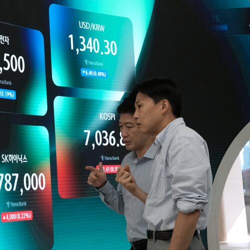 Currency traders work near a screen showing the Korea Composite Stock Price Index (KOSPI), the foreign exchange rate between U.S. dollar and South Korean won, SK Hynix and Samsung Electronics Co. stock price at the foreign exchange dealing room of the Hana Bank headquarters in Seoul, South Korea, Tuesday, Sept. 8, 2026. (AP Photo/Ahn Young-joon)
