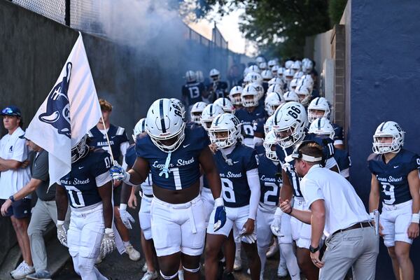 The Marietta Blue Devils take the field during their game against Etoway Friday, Sept. 19, 2025 at Northcutt Stadium in Marietta. (Daniel Varnado/For the Atlanta Journal-Constitution)