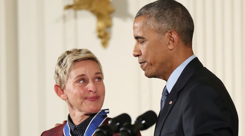 Actress, comedian, and talk show host Ellen DeGeneres, glances at President Barack Obama as she is presented the Presidential Medal of Freedom during a ceremony in the East Room of the White House Tuesday, Nov. 22, 2016, in Washington. Obama is recognizing 21 Americans with the nation's highest civilian award, including giants of the entertainment industry, sports legends, activists and innovators. (AP Photo/Manuel Balce Ceneta)