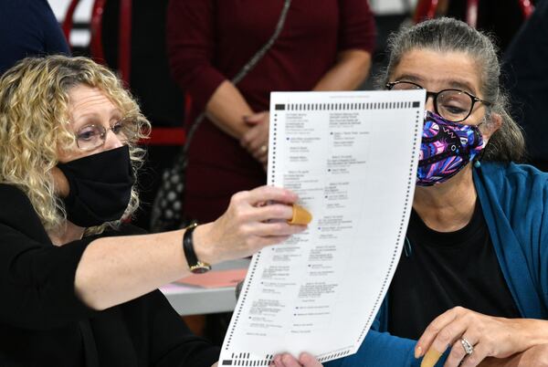 Election workers in Gwinnett County began working through a recount of ballots on Nov. 13, 2020. (Hyosub Shin/AJC)