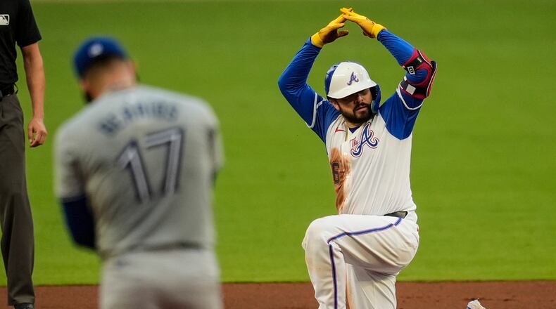 Atlanta Braves' Travis d'Arnaud (16) celebrates after hitting a double against the Toronto Blue Jays on Saturday, Sept. 7, 2024, in Atlanta. (AP Photo/Mike Stewart)