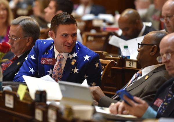 State Rep. David Clark (left), R-Buford, speaks with Rep. Mack Jackson, D-Sandersville, at the state Capitol in 2015. (Brant Sanderlin/AJC)