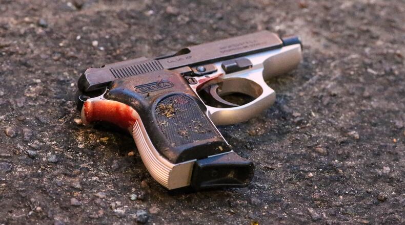 Gun at a different Atlanta shooting scene. (John Spink / jspink@ajc.com / AJC file photo)
