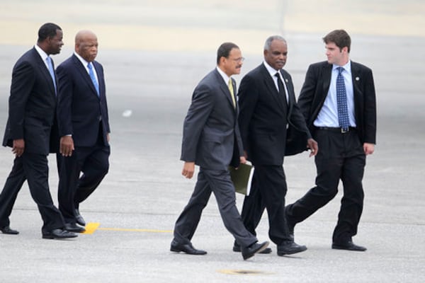 From left, Atlanta Mayor Kasim Reed, U.S. Rep. Reps. John Lewis, Sanford Bishop and David Scott, seen here in 2010 on their way to greet then President Barack Obama during a visit to Atlanta. (Bob Andres/AJC file photo)