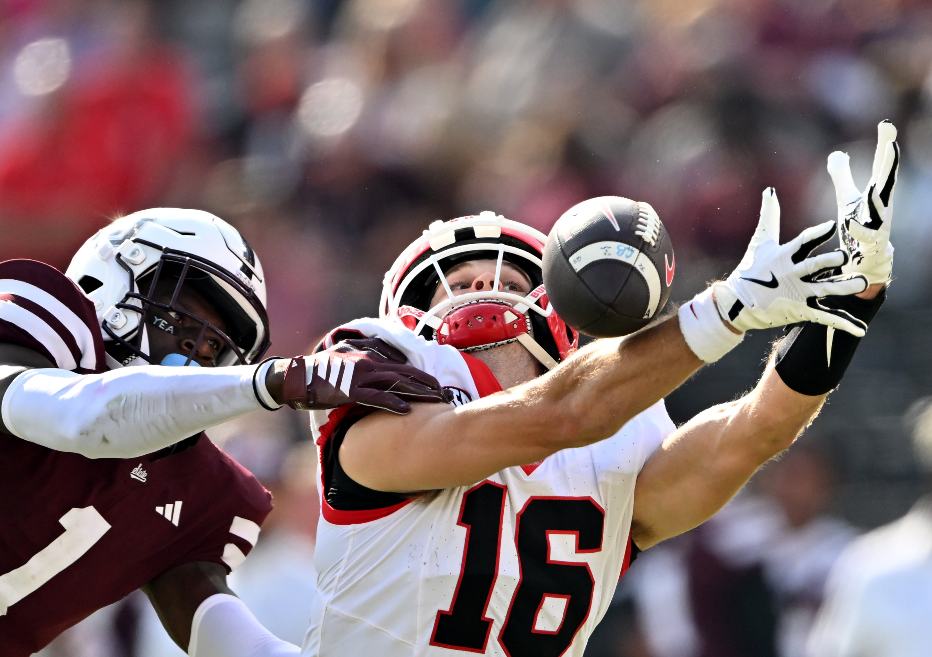 Georgia wide receiver London Humphreys (16) is not able to catch under pressure from Mississippi State cornerback Kelley Jones (1) during the second half in an NCAA football game at Davis Wade Stadium, Saturday, November 8, 2025, in Starkville, Mississippi. Georgia won 41-21 over Mississippi State. (Hyosub Shin / AJC)
