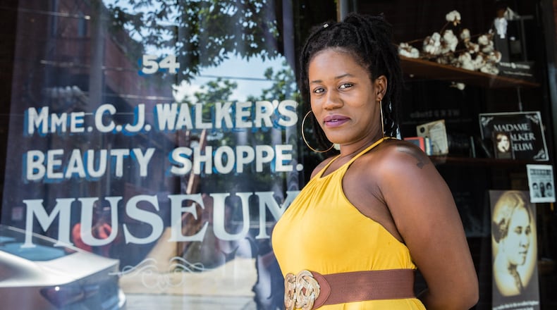 Tamika Newhouse has published 17 books. Newhouse is standing on Auburn Avenue on Wednesday, June 3, 2020. Photo: Jenni Girtman for The Atlanta Journal-Constitution
