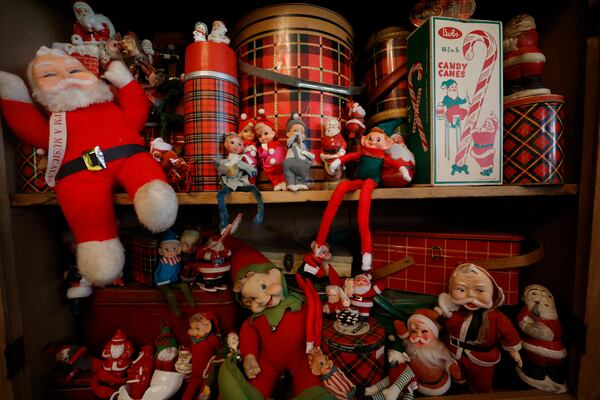 Kathy Trocheck has no idea how many vintage Santas she's collected by now. "It's really hoarding at this point," she says.  (Natrice Miller/ Natrice.miller@ajc.com)