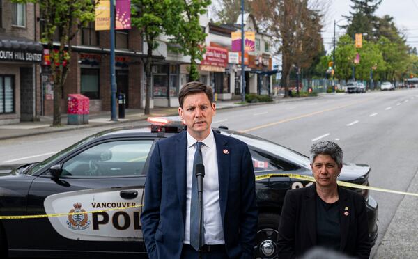 British Columbia Premier David Eby, left, delivers remarks after a vehicle drove into crowd during a Lapu Lapu Day festival in Vancouver, British Columbia, Sunday, April 27, 2025. (Rich Lam/The Canadian Press via AP)