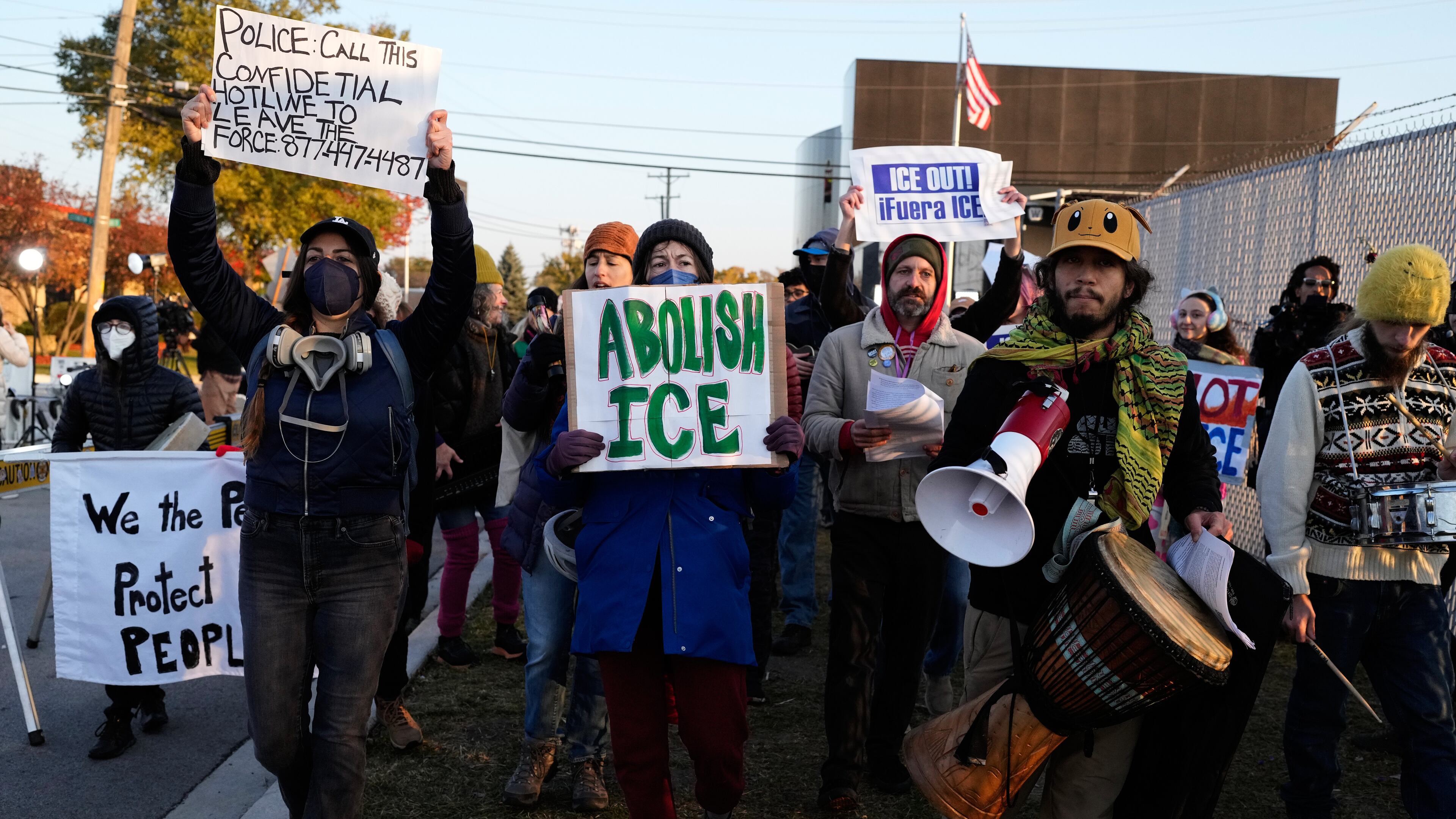 Protesters gather outside an ICE processing facility in the Chicago suburb of Broadview, Ill., Friday, Oct. 31, 2025. (AP Photo/Nam Y. Huh)
