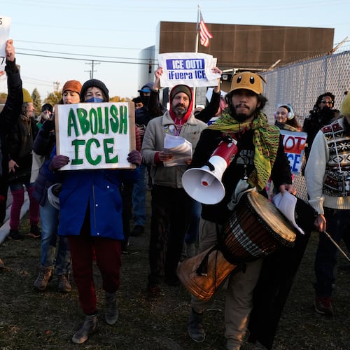Protesters gather outside an ICE processing facility in the Chicago suburb of Broadview, Ill., Friday, Oct. 31, 2025. (AP Photo/Nam Y. Huh)