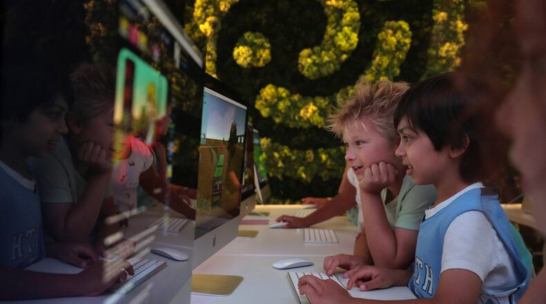Left, Cillian Rhodes and Shayaan Cleaver work on computers at Codeverse, 815 W. Eastman in Chicago, Ill. on Thursday, Aug. 23, 2018. (Antonio Perez/Chicago Tribune/TNS)