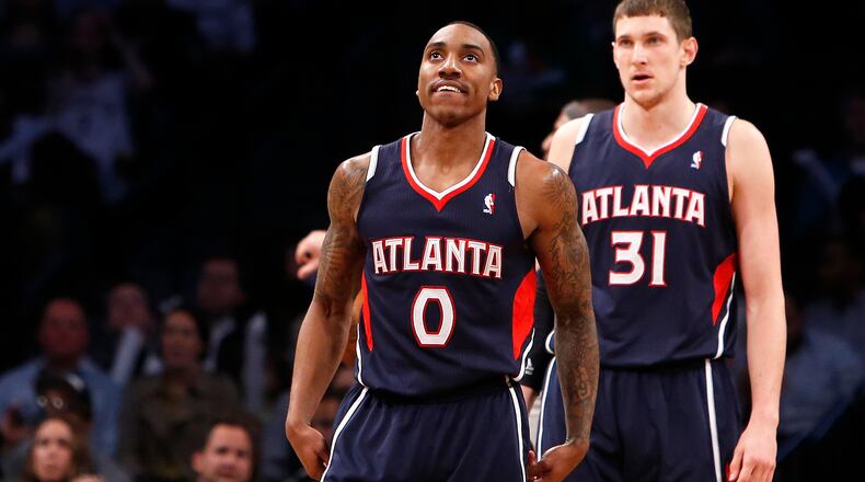 Atlanta Hawks' Jeff Teague (0) reacts after scoring against the Brooklyn Nets during the first half of an NBA basketball game Friday, April 11, 2014, in New York. (AP Photo/Jason DeCrow)