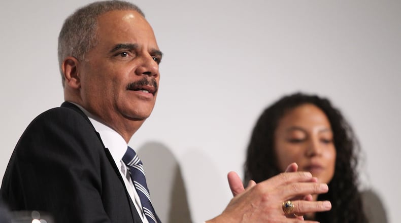 Former U.S. Attorney General Eric Holder speaks while fellow panelist Elizabeth Hinton listens in the background at the Jimmy Carter Presidential Library and Museum in Atlanta in 2017. Holder is the chairman of a Democratic political group that filed a lawsuit attempting to throw out Georgia’s congressional districts. (HENRY TAYLOR / HENRY.TAYLOR@AJC.COM)