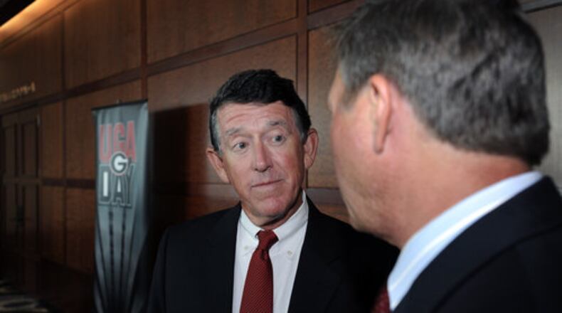 UGA Athletic Director Greg McGarity, left, said “cost of attendance” is a very complex issue that Georgia and the SEC are still trying to get their arms around. (AJC photo)