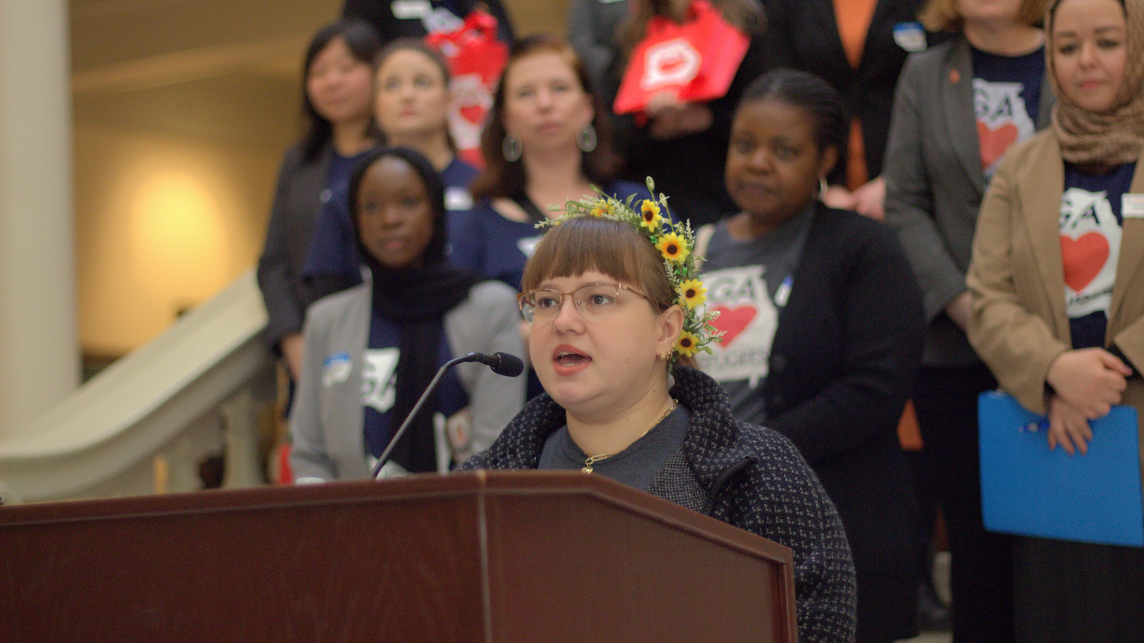 Ukrainian Refugee Storytellers Collective member Mariia Yatsko delivers remarks at the New Americans Celebration, Georgia’s premier day of education and advocacy for refugees, immigrants, and their allies at the State Capitol.