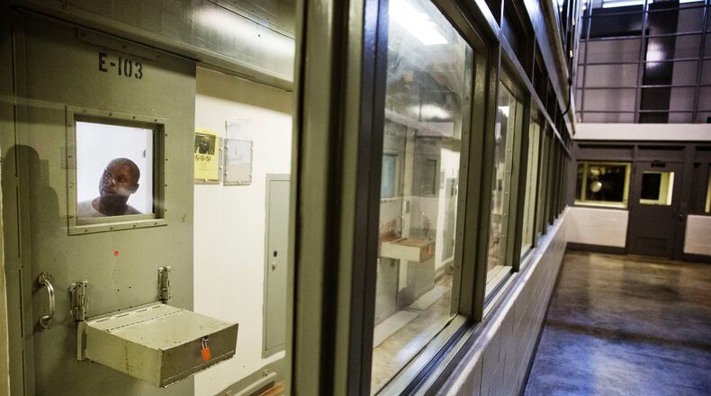 An inmate looks out of his cell in 2015 in the the Special Management Unit, a maximum security unit at the Georgia Diagnostic and Classification Prison in Jackson, Georgia. (David Goldman/AP)