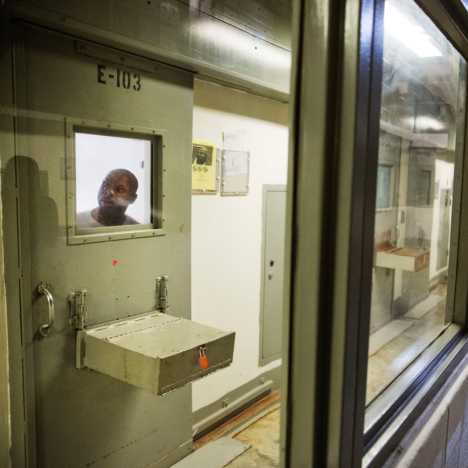 A prisoner looks out of his cell in the Special Management Unit at the Georgia Diagnostic and Classification Prison in this 2015 file photo. In a damning ruling, U.S. District Judge Marc Treadwell wrote in April that state prison officials showed no desire or intention to make the required changes to SMU's solitary confinement practices. (David Goldman/AP 2015 file)