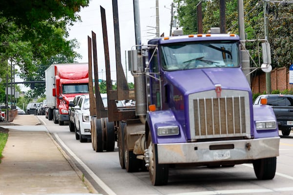 Heavy traffic, including trucks, travels along Main Street in downtown Watkinsville around lunchtime on Thursday, May 29, 2026. (Miguel Martinez/AJC)