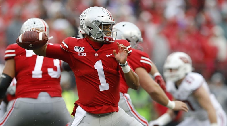 Justin Fields, Ohio State's quarterback, is expected to be a high draft pick. (Adam Cairns/Columbus Dispatch/TNS)