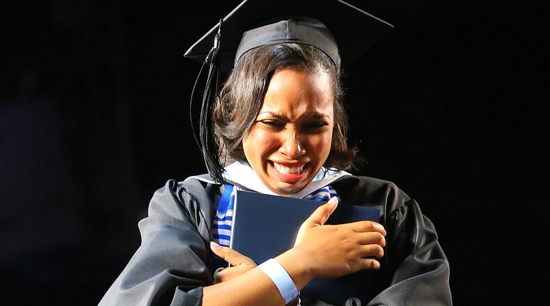An emotional Tiffany Greene at Spelman College's commencement: "Being able to walk across the stage was a victory for me. But it was also just, you know, the end of a really hard journey." (Curtis Compton / ccompton@ajc.com)