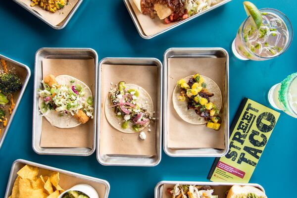 The Baja Fish Taco, the Smoked Brisket Taco, the Al Pastor Taco and the Fitti cocktail are just some of your options at Marietta Street Market’s Street Taco, which has its own dining room. CONTRIBUTED BY MIA YAKEL