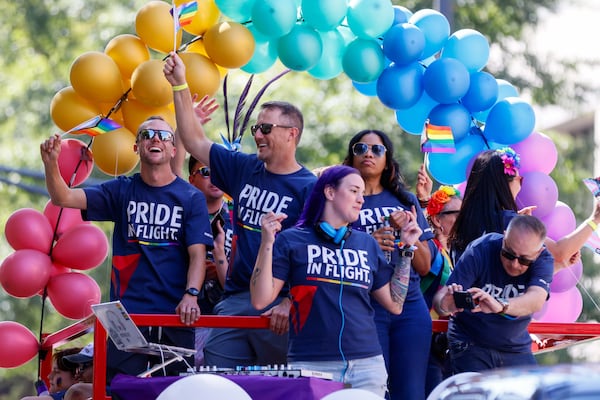 People with Delta Air Lines celebrate during the annual Pride Parade, Oct. 13, 2024. (Miguel Martinez/AJC)