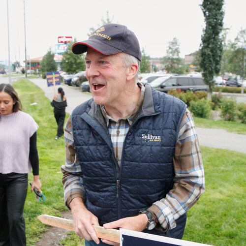 Sen. Dan Sullivan, R-Alaska, arrives to wave signs at an intersection during morning rush hour in Anchorage, Alaska, Tuesday, Aug. 18, 2026. (AP Photo/Mark Thiessen)
