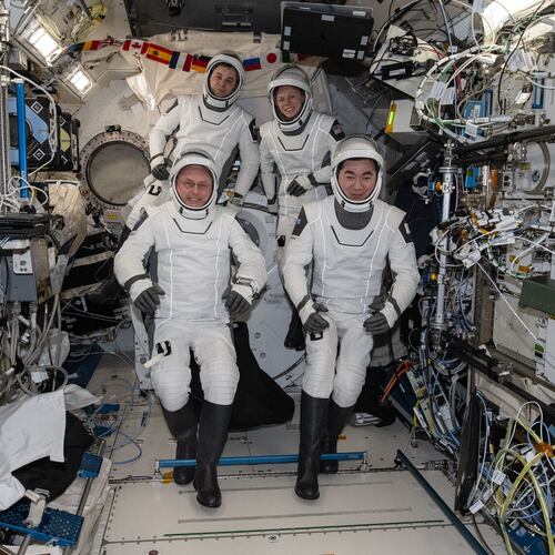 This photo provided by NASA shows clockwise from bottom left are, NASA astronaut Mike Fincke, Roscosmos cosmonaut Oleg Platonov, NASA astronaut Zena Cardman, and JAXA (Japan Aerospace Exploration Agency) astronaut Kimiya Yui gathering for a crew portrait wearing their Dragon pressure suits during a suit verification check inside the International Space Station’s Kibo laboratory module, Wednesday, Jan. 14, 2026. (NASA via AP)