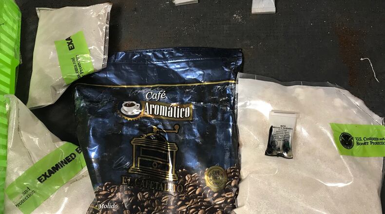 About a kilogram of cocaine was found hidden inside a coffee bag within a Guatemalan man's luggage at the Atlanta airport Friday, authorities said.