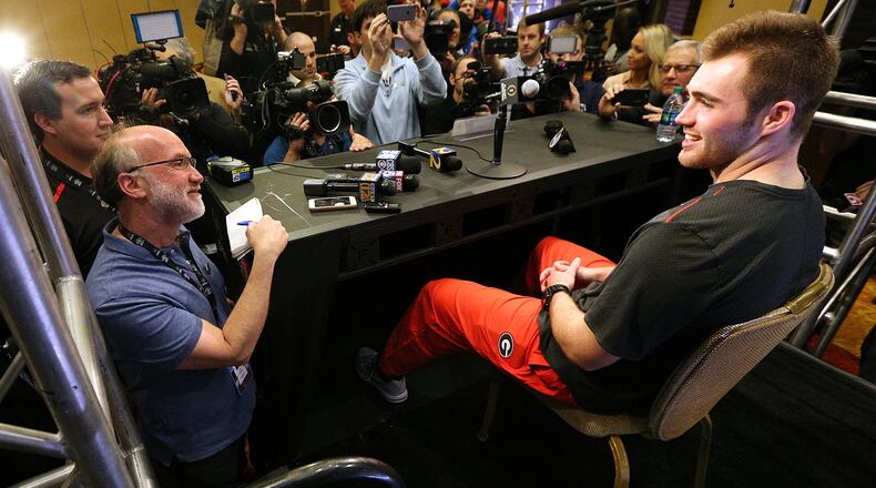 Georgia quarterback Jake Fromm is surrounded by media members with questions during his press conference for the Rose Bowl Thursday. It was Fromm’s first formal press conference since he signed his letter of intent.