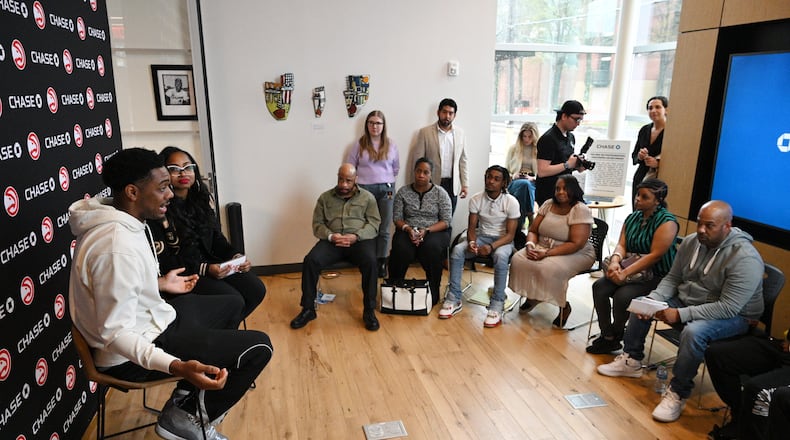 Atlanta Hawks guard Trent Forrest (left) speaks as Alexis Roe (second from left), Atlanta Hawks’ Vice President of DEI Impact and Strategic Initiatives, moderates during educational workshops to enhance their financial health and understanding of business finances at Summerhill Chase Community Center Branch, Tuesday, March 26, 2024, in Atlanta. The Atlanta Hawks and Chase are launching a new community program for aspiring entrepreneurs impacted by the justice system. (Hyosub Shin / Hyosub.Shin@ajc.com)