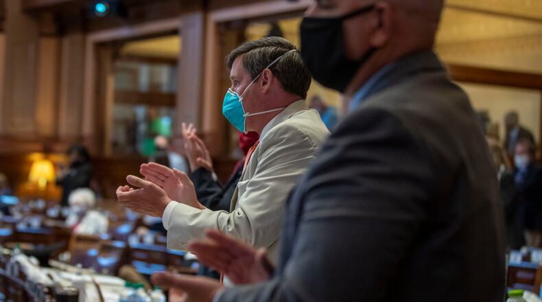 Members of the Georgia House of Representatives wear masks in June, when the 2020 legislative session resumed after being suspended in March as a caution against COVID-19. (ALYSSA POINTER / ALYSSA.POINTER@AJC.COM)