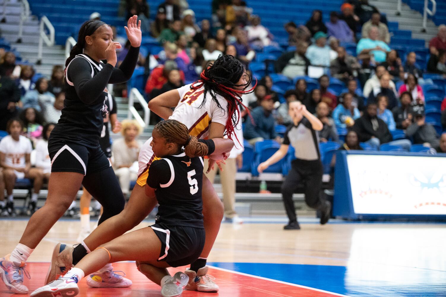 Kell's Makayah Harris trys to get the ball from Jackson's British McKinney. Jamie Spaar for the Atlanta Journal-Constitution