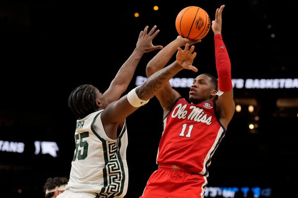 Mississippi guard Matthew Murrell (11) shoots against Michigan State forward Coen Carr (55) during the first half in the Sweet 16 of the NCAA college basketball tournament, Friday, March 28, 2025, in Atlanta. (AP Photo/George Walker IV)