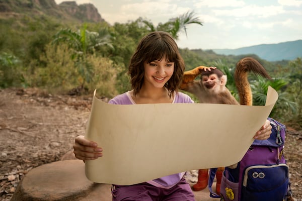 This image released by Paramount+ shows Dora, portrayed by Samantha Lorraine, center, and Boots, voiced by Gabriel "Fluffy" Iglesias, in a scene from "Dora and the Search for Sol Dorado." (Nickelodeon/Paramount+ via AP)