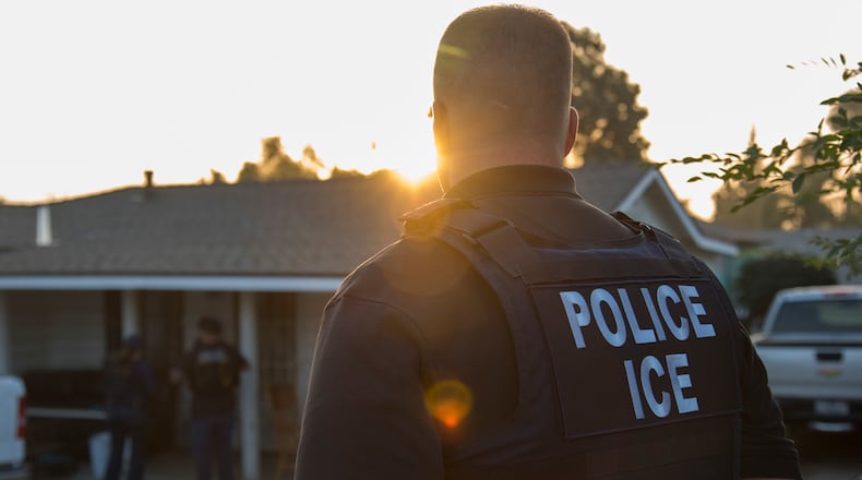 Every day around the U.S., from before sunrise until late into the night, undocumented immigrants are being picked up by ICE officers, the front-line soldiers in President Donald Trump's crackdown on illegal immigration. Photo from a predawn raid in California in 2017. (Melissa Lyttle/The New York Times 2017)