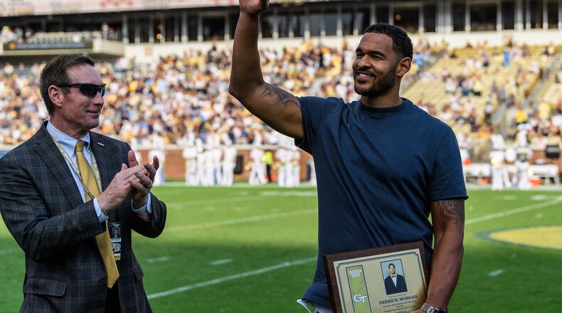 Former Georgia Tech All-American and 2009 ACC defensive player of the year Derrick Morgan acknowledges fans at halftime of Tech's game against North Carolina at Bobby Dodd Stadium Oct. 5, 2019. Morgan was inducted into Tech's sports hall of fame the previous night. (Danny Karnik/Georgia Tech Athletics)