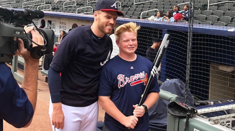 Braves first baseman Freddie Freeman met with Matt Klug before playing the Baltimore Orioles at SunTrust Park on Friday. (Photo by Tess DeMeyer/AJC)