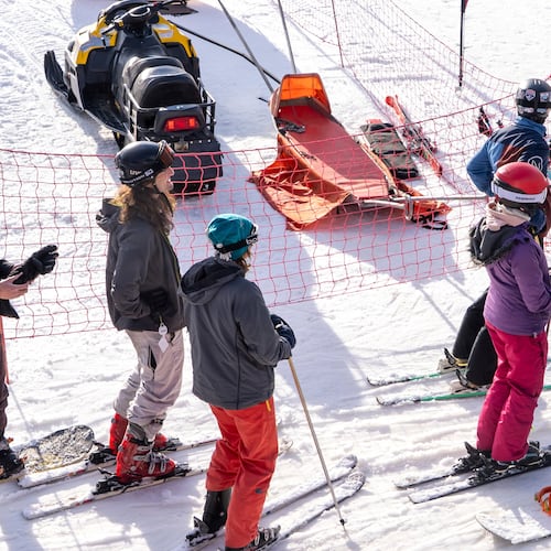 A group of skiers gather on the slopes at Afriski Mountain Resort in Maluti, Lesotho, Saturday, July 11, 2026. (AP Photo/Kayleen Morgan)