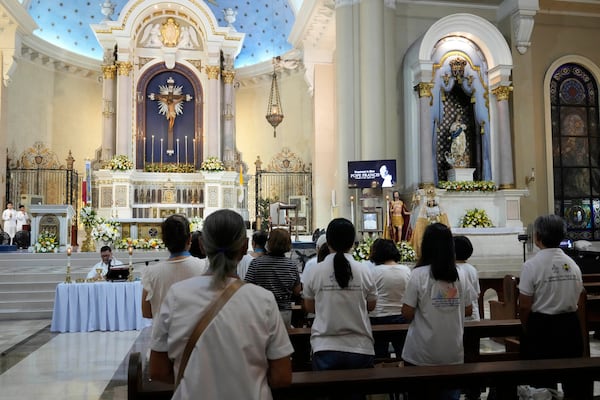 Devotees pray during a mass for the late Pope Francis at the Cubao Cathedral in Quezon city, Philippines Monday, April 21, 2025. (AP Photo/Aaron Favila)