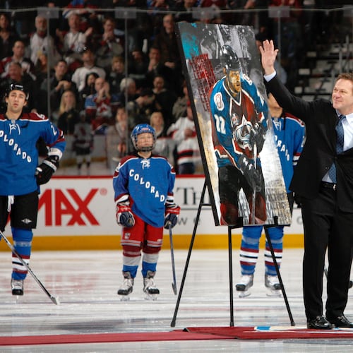 FILE - Retired Colorado Avalanche player Claude Lemieux waves to fans as he is honored for his years on the ice before the Avalanche host the New Jersey Devils in the first period of an NHL hockey game in Denver, Saturday, Jan. 16, 2010. (AP Photo/David Zalubowski, File)