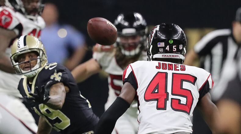 Falcons linebacker Deion Jones intercepts Saints quarterback Drew Brees during the third quarter in a NFL football game on Sunday, December 24, 2017, in New Orleans.