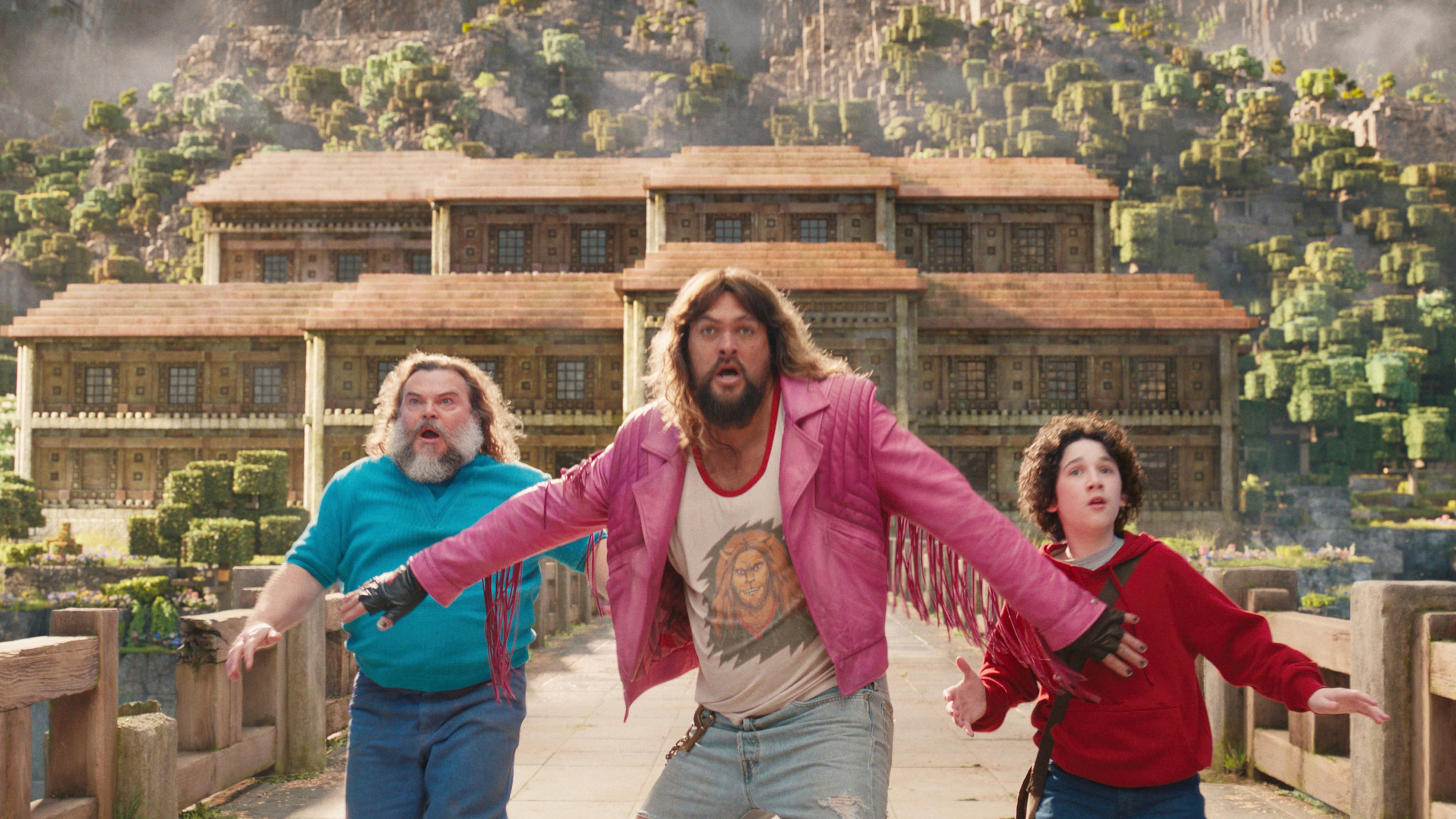 This image released by Warner Bros. Pictures shows, from left, Jack Black, Jason Momoa and Sebastian Hansen in a scene from "A Minecraft Movie." (Warner Bros. Pictures via AP)