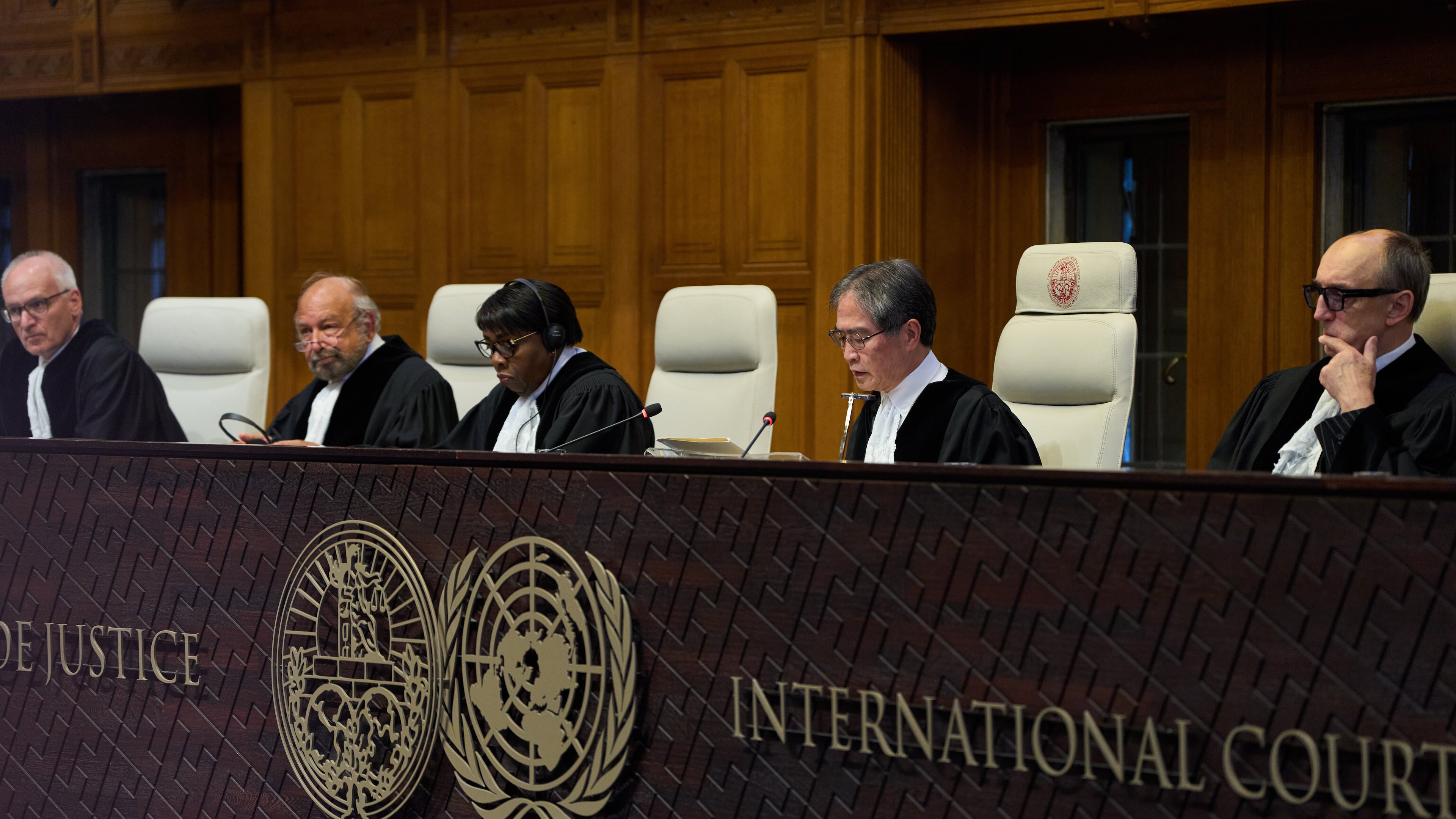 Presiding Judge Yuji Iwasawa, second right, starts reading the advisory opinion of the International Court of Justice on what Israel must do to ensure humanitarian aid reaches Palestinians in Gaza and the occupied West Bank, in The Hague, Netherlands, Wednesday, Oct. 22, 2025. (AP Photo/Peter Dejong)
