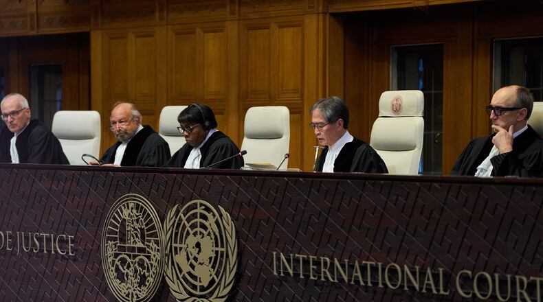 Presiding Judge Yuji Iwasawa, second right, starts reading the advisory opinion of the International Court of Justice on what Israel must do to ensure humanitarian aid reaches Palestinians in Gaza and the occupied West Bank, in The Hague, Netherlands, Wednesday, Oct. 22, 2025. (AP Photo/Peter Dejong)