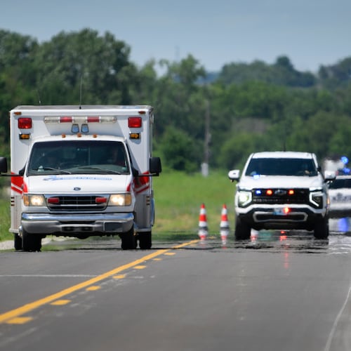 An emergency vehicle leaves the scene of the plane crash at the Butler Memorial Airport in Butler, Mo., Sunday, June 14, 2026. (AP Photo/Reed Hoffmann)