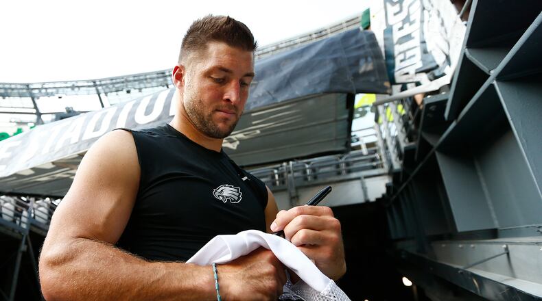 EAST RUTHERFORD, NJ - SEPTEMBER 03: Tim Tebow #11of the Philadelphia Eagles signs autographs before a pre-season game against the New York Jets at MetLife Stadium on September 3, 2015 in East Rutherford, New Jersey. (Photo by Rich Schultz /Getty Images)