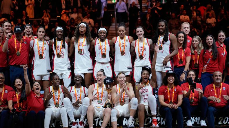 United States team poses with medals after winning the Women's Basketball World Cup final match between the United States and France in Berlin, Sunday, Sept. 13, 2026. (AP Photo/Ebrahim Noroozi)